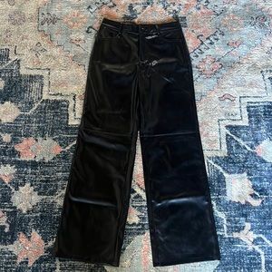 NWOT comfy black faux leather pants, warm lining. Women’s size small/medium.